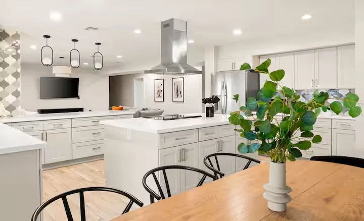 Open kitchen with island and dining table