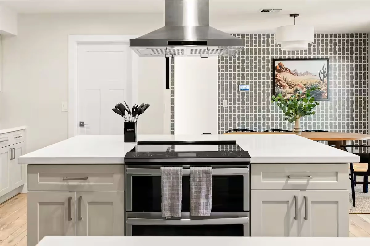 Chef's kitchen with a large marble island